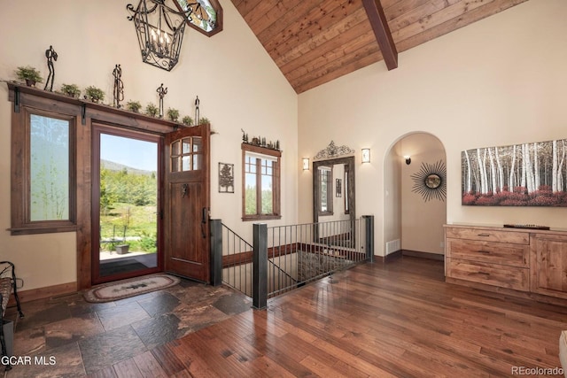 2621 Gcr 519, Tabernash, CO 80478 - entryway featuring high vaulted ceiling, a wooden ceiling with exposed beams, arched walkways, wood finished floors, and a chandelier