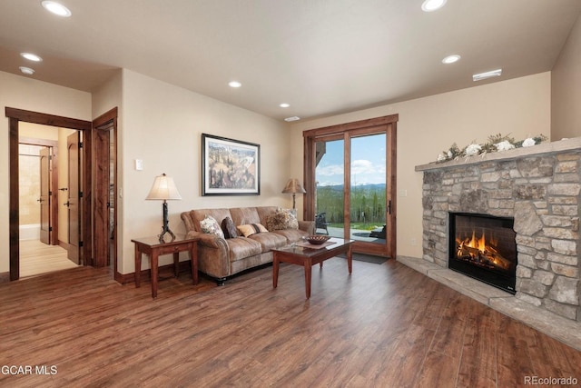 2621 Gcr 519, Tabernash, CO 80478 - living area with wood finished floors, a stone fireplace, and recessed lighting