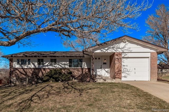 single story home with a garage, driveway, a front yard, and brick siding