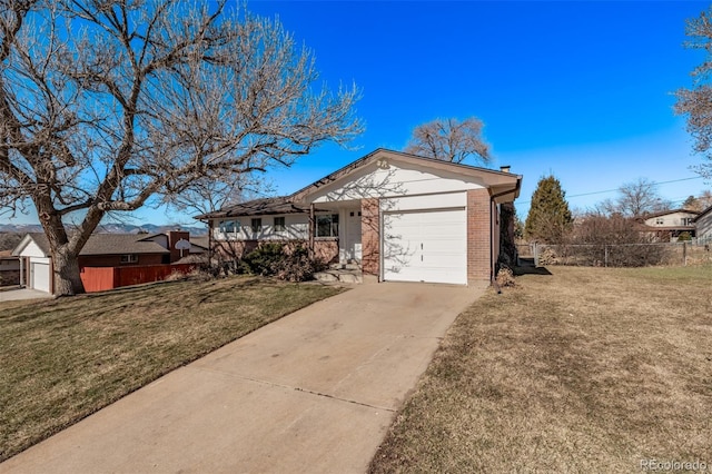 view of front of property with a garage, a front yard, concrete driveway, and brick siding