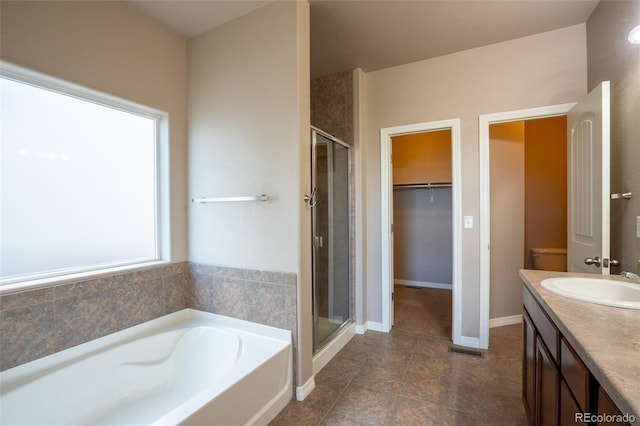 1985 Reed Grass Way, Colorado Springs, CO 80915 - bathroom with a shower stall, a bath, vanity, and tile patterned flooring