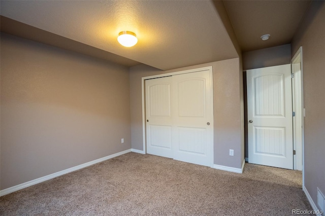 1985 Reed Grass Way, Colorado Springs, CO 80915 - unfurnished bedroom featuring a closet and carpet floors