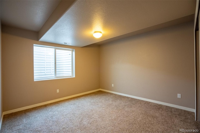 1985 Reed Grass Way, Colorado Springs, CO 80915 - carpeted empty room featuring baseboards and a textured ceiling
