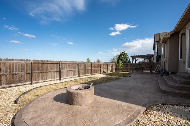 1985 Reed Grass Way, Colorado Springs, CO 80915 - fenced backyard with a patio, a pergola, and an outdoor fire pit
