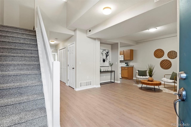 4109 Sunny Vista Hts, Colorado Springs, CO 80918 - living area featuring light wood-style flooring and stairway