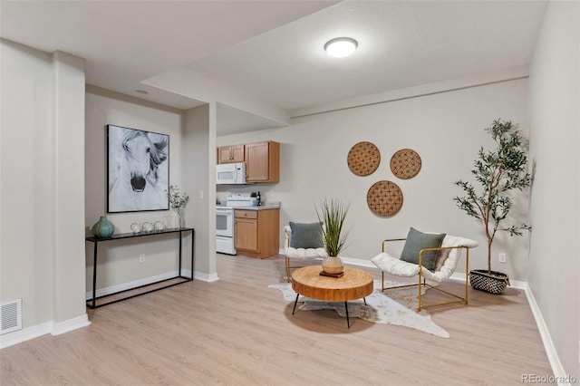4109 Sunny Vista Hts, Colorado Springs, CO 80918 - sitting room featuring light wood-style floors and baseboards