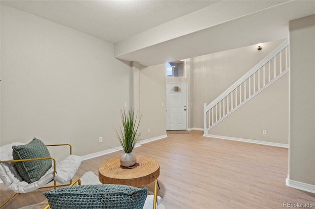 4109 Sunny Vista Hts, Colorado Springs, CO 80918 - sitting room with light wood-style floors and stairway