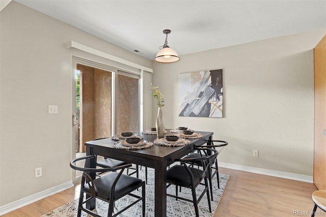 4109 Sunny Vista Hts, Colorado Springs, CO 80918 - dining area with baseboards and light wood-style flooring