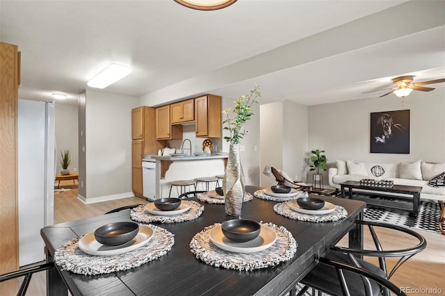 4109 Sunny Vista Hts, Colorado Springs, CO 80918 - dining room with light wood-style floors and a ceiling fan