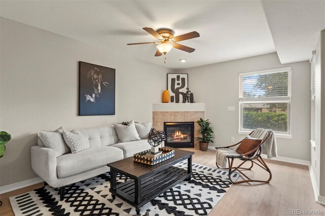 4109 Sunny Vista Hts, Colorado Springs, CO 80918 - living room with a ceiling fan, wood finished floors, and a tile fireplace