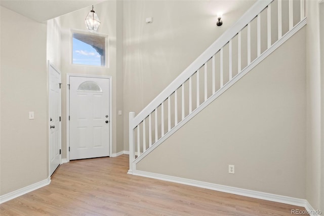 4109 Sunny Vista Hts, Colorado Springs, CO 80918 - entryway with stairway, light wood-style floors, and a high ceiling