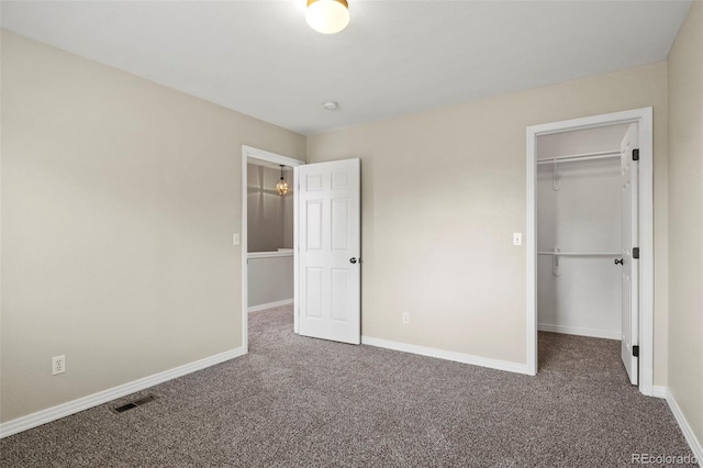 4109 Sunny Vista Hts, Colorado Springs, CO 80918 - unfurnished bedroom with carpet floors, a walk in closet, and a closet