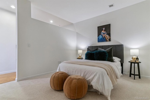 bedroom with light colored carpet