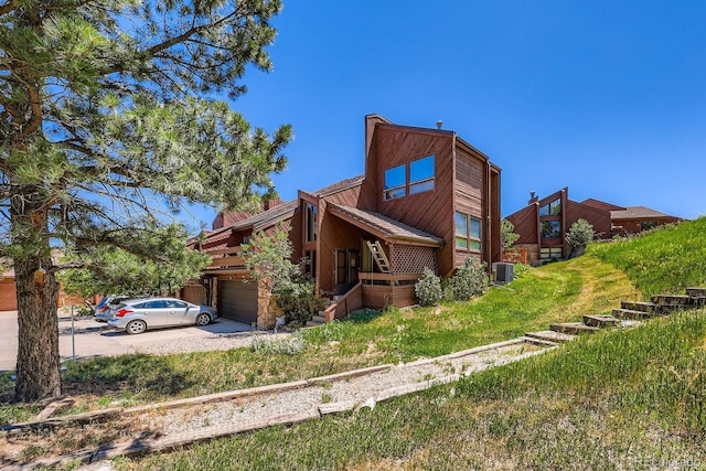 4484 Juniper Ct, Larkspur, CO 80118 - view of home's exterior featuring a garage and concrete driveway
