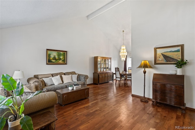 living room featuring beamed ceiling, high vaulted ceiling, dark hardwood / wood-style flooring, and an inviting chandelier