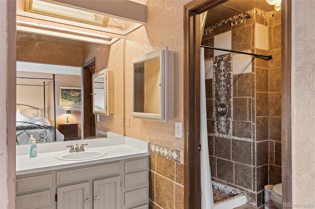 bathroom featuring vanity, toilet, and a shower with shower curtain