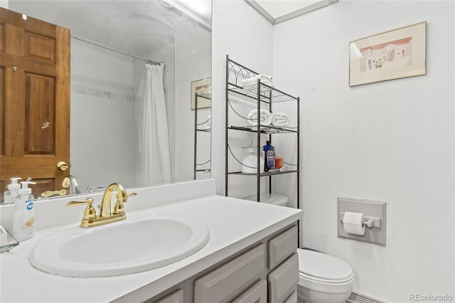 bathroom with a shower with curtain, vanity, and toilet