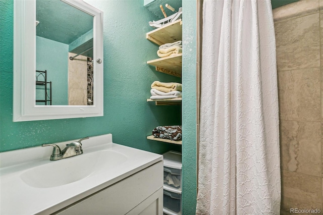 bathroom with vanity and curtained shower