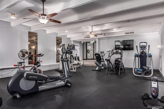 workout area with a textured ceiling and ceiling fan