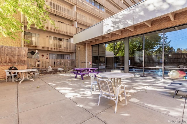 view of patio featuring a balcony