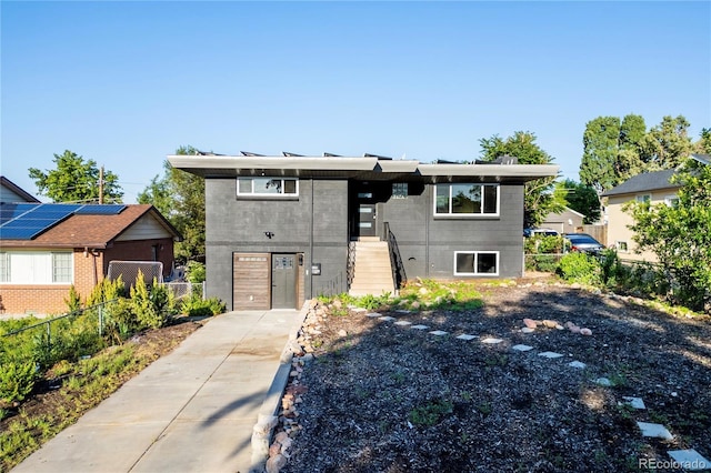 220 S Raleigh St, Denver, CO 80219 - view of front of house with concrete driveway and stairs