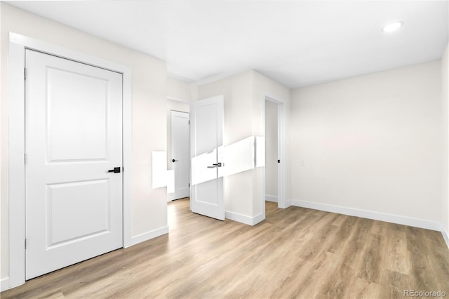 220 S Raleigh St, Denver, CO 80219 - unfurnished bedroom featuring light wood-type flooring and recessed lighting