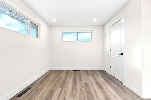 220 S Raleigh St, Denver, CO 80219 - unfurnished bedroom with wood finished floors and recessed lighting