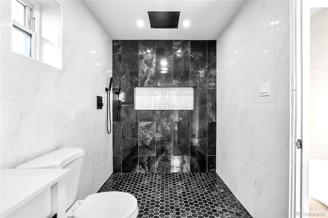 220 S Raleigh St, Denver, CO 80219 - full bath featuring tiled shower, tile walls, and recessed lighting