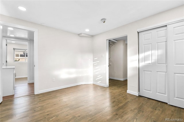 220 S Raleigh St, Denver, CO 80219 - unfurnished bedroom featuring wood finished floors, recessed lighting, and a closet