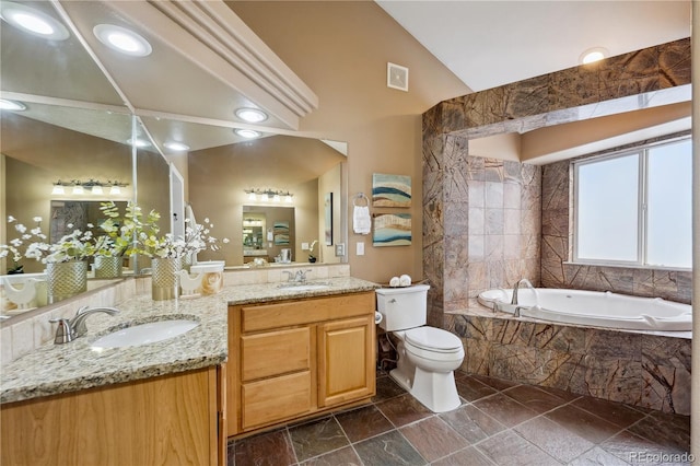 6595 Meade Ct, Arvada, CO 80003 - bathroom with toilet, vaulted ceiling, a bath, and double vanity