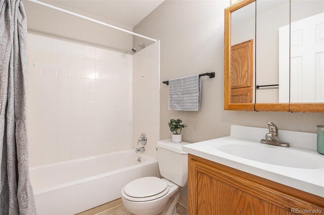 bathroom with toilet, vanity, and shower / bathing tub combination