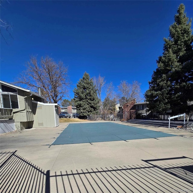 view of pool with fence and a patio