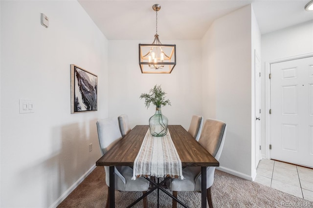 dining space with light carpet, baseboards, and an inviting chandelier