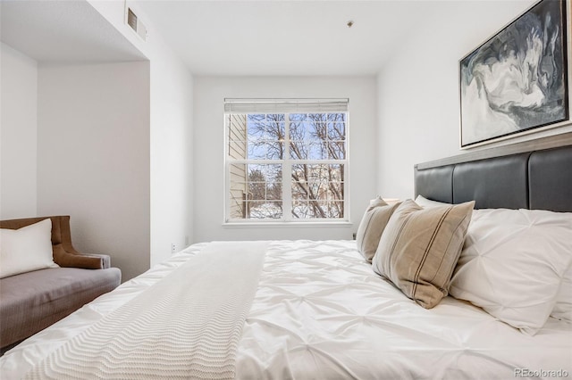 bedroom featuring visible vents