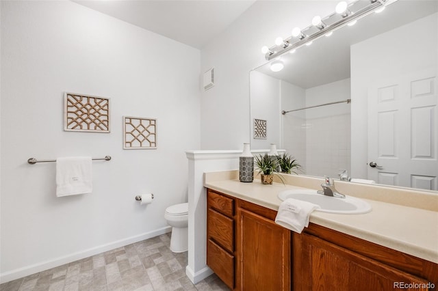 full bath featuring baseboards, visible vents, toilet, walk in shower, and vanity