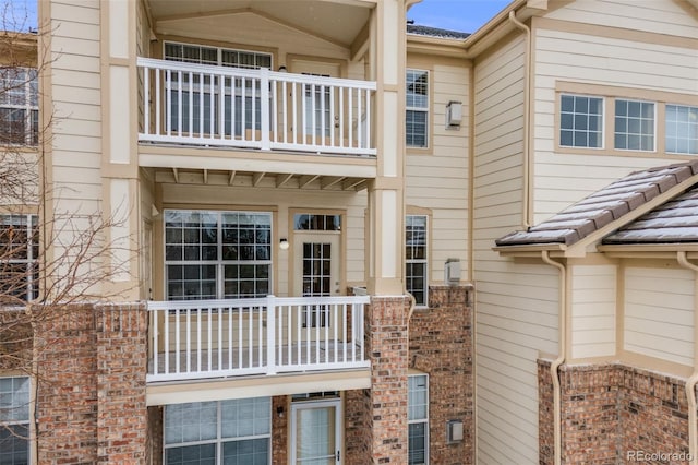 exterior space with brick siding