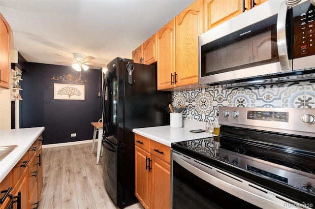 2325 S Linden Ct Unit 101, Denver, CO 80222 - kitchen with stainless steel appliances, light wood-type flooring, light countertops, ceiling fan, and tasteful backsplash