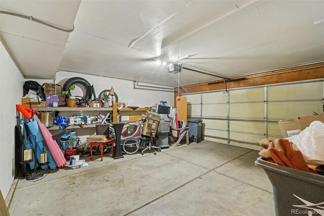 2408 Concord Cir, Lafayette, CO 80026 - garage featuring a garage door opener