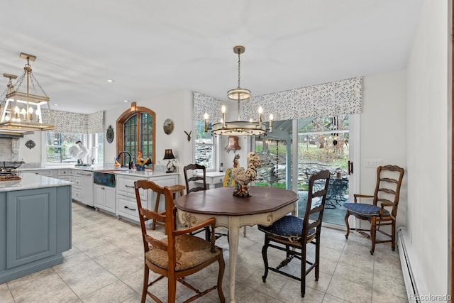 689 Red Deer Rd, Franktown, CO 80116 - dining room featuring a chandelier, a baseboard radiator, plenty of natural light, recessed lighting, and light tile patterned floors