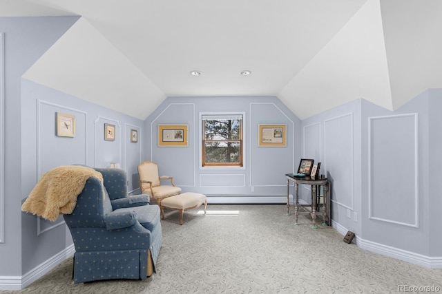 689 Red Deer Rd, Franktown, CO 80116 - living area featuring baseboard heating, carpet floors, lofted ceiling, baseboards, and a decorative wall