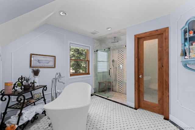 689 Red Deer Rd, Franktown, CO 80116 - full bathroom featuring a shower stall, a soaking tub, tile patterned floors, vaulted ceiling, and recessed lighting