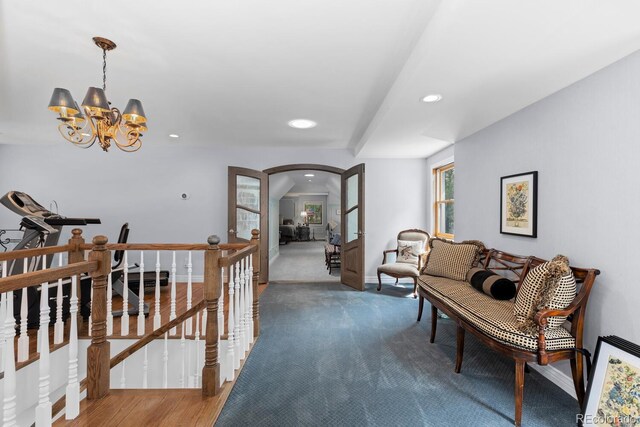 689 Red Deer Rd, Franktown, CO 80116 - corridor with an upstairs landing, arched walkways, a chandelier, recessed lighting, and baseboards