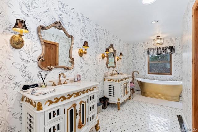 689 Red Deer Rd, Franktown, CO 80116 - bathroom featuring two vanities, wallpapered walls, and a soaking tub
