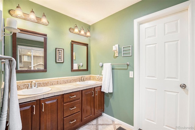 bathroom with tile patterned flooring and vanity