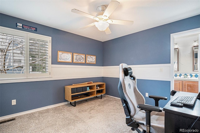 office area featuring ceiling fan and carpet floors