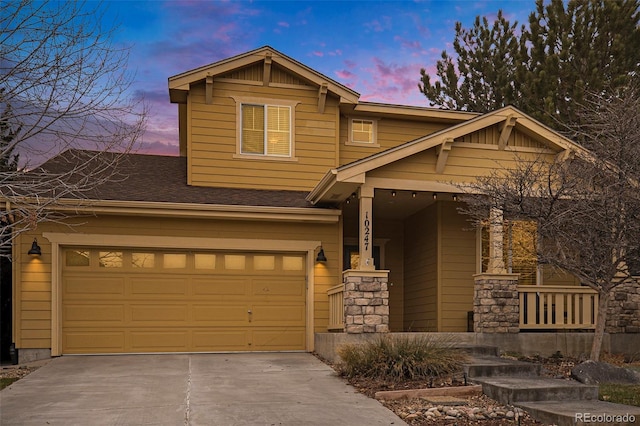 craftsman-style home featuring a porch and a garage