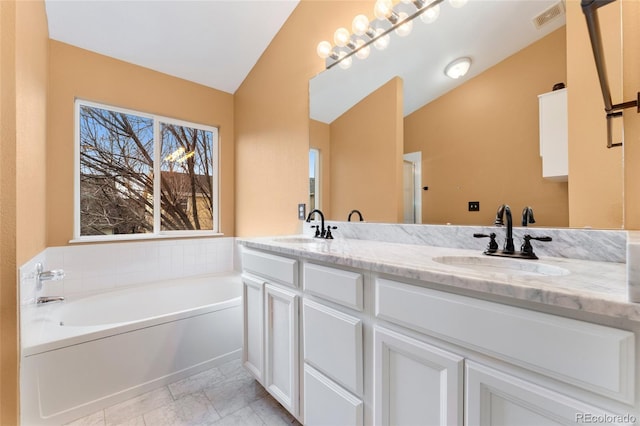 7860 E Ellsworth Ave, Denver, CO 80230 - bathroom featuring double vanity, a bath, and lofted ceiling