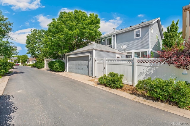 7860 E Ellsworth Ave, Denver, CO 80230 - view of front facade with a detached garage