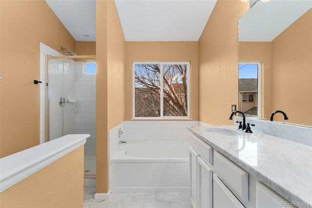 7860 E Ellsworth Ave, Denver, CO 80230 - bathroom featuring a garden tub, vanity, tiled shower, and marble finish floors