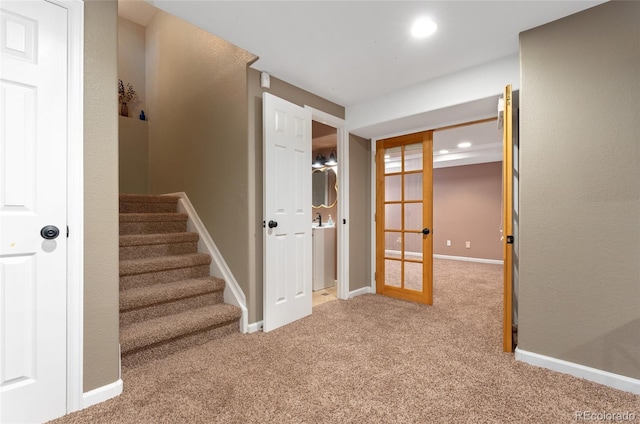 7860 E Ellsworth Ave, Denver, CO 80230 - stairs featuring carpet floors, baseboards, french doors, and recessed lighting